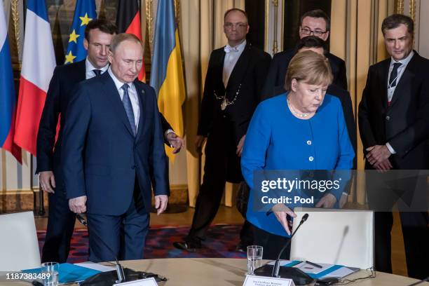 French President Emmanuel Macron, Russian President Vladimir Putin, German Chancellor Angela Merkel and Ukrainian President Volodymyr Zelensky attend...
