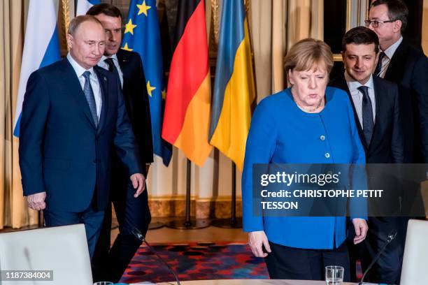 Russian President Vladimir Putin, French President Emmanuel Macron, German Chancellor Angela Merkel and Ukrainian President Volodymyr Zelensky arrive...