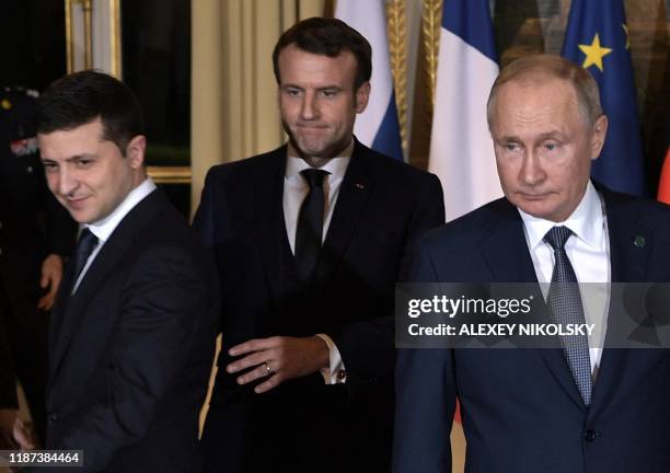 Ukrainian President Volodymyr Zelensky, French President Emmanuel Macron and Russian President Vladimir Putin arrive for a meeting on Ukraine with...