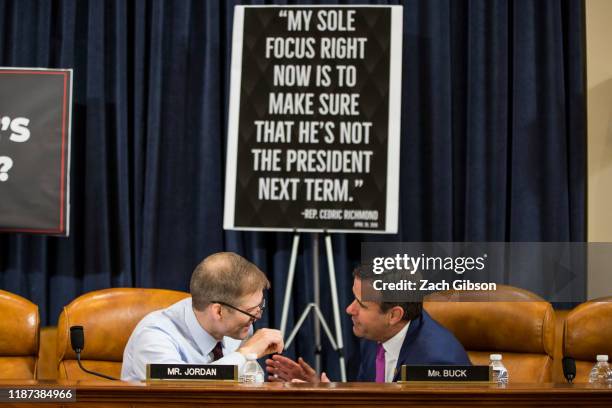 Rep. Jim Jordan, speaks to Rep. John Ratcliffe during break during a House Judiciary Committee hearing questioning staff lawyer Stephen Castor,...