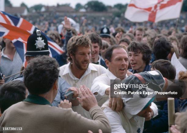 England cricketers Ian Botham, Geoffrey Boycott and wicketkeeper Bob Taylor make their way through the crowd after England win the 3rd Test match...