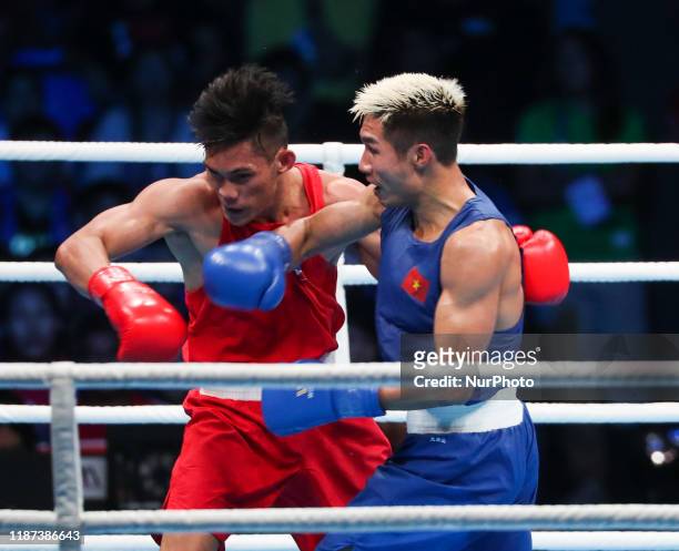 Van Hai Nguyen of Vietnam connects a right hook to James Palicte of the Philippines in the gold medal match of the Men's Boxing light welterweight...