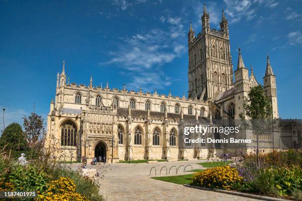 gloucester cathedral,  gardens, flower display,  gloucestershire, england, uk - gloucester cathedral stock pictures, royalty-free photos & images