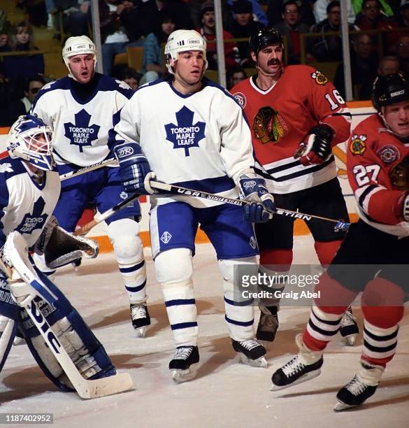 Peter Ing, Al Iafrate and Luke Richardson of the Toronto Maple Leafs skate agains Michel Goulet and Jeremy Roenick of the Chicago Blackhawks during...