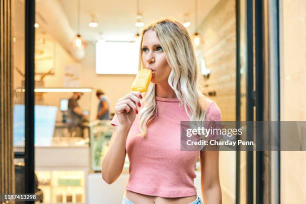 i would eat this everyday if i could - blond women happy eating stock pictures, royalty-free photos & images