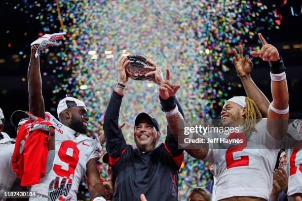 Big Ten Championship Game: Ohio State coach Ryan Day victorious, holding up Big Ten trophy with Chase Young and Binjimen Victor after winning game vs...