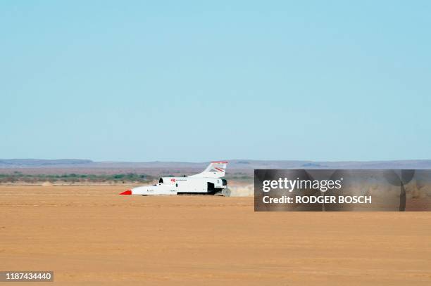 The jet-propelled British Bloodhound LSR car drives at about 900km/h, on November 15 during preliminary tests at Hakskeenpan in the Northern Cape...
