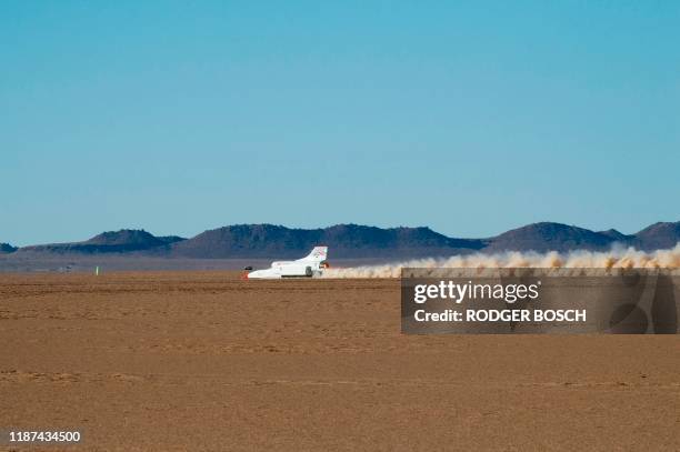 The jet-propelled British Bloodhound LSR car drives at about 900km/h, on November 15 during preliminary tests at Hakskeenpan in the Northern Cape...