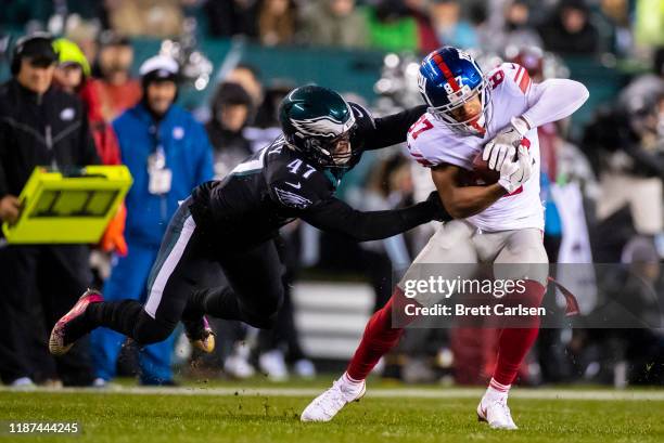 Sterling Shepard of the New York Giants sheds a tackle attempt by Nate Gerry of the Philadelphia Eagles during the first quarter at Lincoln Financial...