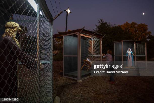 Christmas nativity scene depicts Jesus, Mary, and Joseph separated and caged, as if asylum seekers detained by U.S. Immigration and Customs...