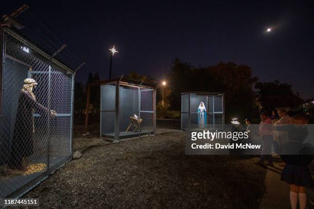 Christmas nativity scene depicts Jesus, Mary, and Joseph separated and caged, as asylum seekers detained by U.S. Immigration and Customs Enforcement,...