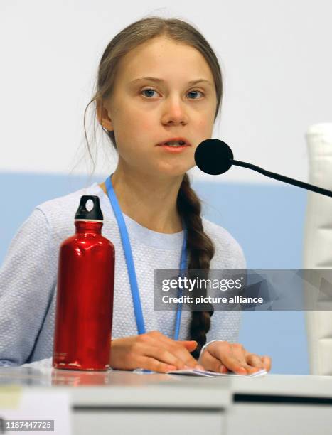 December 2019, Spain, Madrid: Greta Thunberg, Swedish climate activist, sits at an event at the UN Climate Change Conference. Photo: Clara Margais/dpa