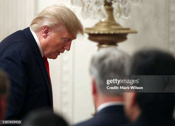 President Donald Trump walks away after a news conference with Turkish President Recep Tayyip Erdogan, in the East Room of the White House on...