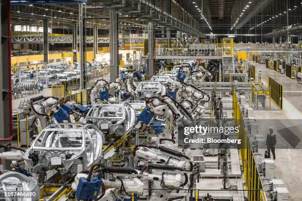 Robotic arms work on the body frames of Vinfast Lux A2.0 sedans in the body shop area of the automaker's factory in Haiphong, Vietnam, on Wednesday,...