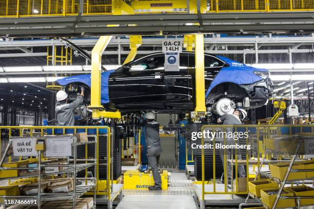 Workers labor on a Vinfast Lux A2.0 sedan at the automaker's factory in Haiphong, Vietnam, on Wednesday, Dec. 4, 2019. Vingroup JSC Chairman Vuong,...