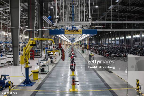 Vinfast Impes electric scooters sit on the assembly line at the automaker's factory in Haiphong, Vietnam, on Wednesday, Dec. 4, 2019. Vingroup JSC...
