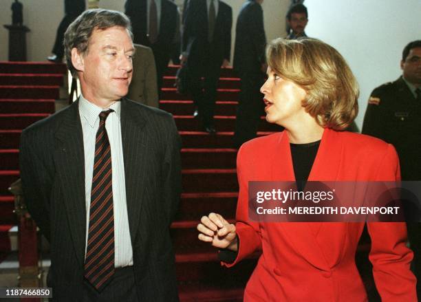 Colombian Foreign Minister Maria Emma Mejia chats with British drug czar Patrick Nixon in Bogota 13 November. Nixon is on a three-day official visit...