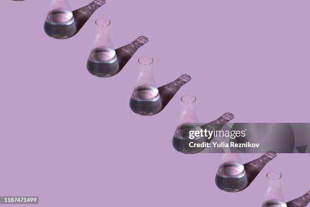 top view of beakers on the pink background - bottles glass top stock pictures, royalty-free photos & images