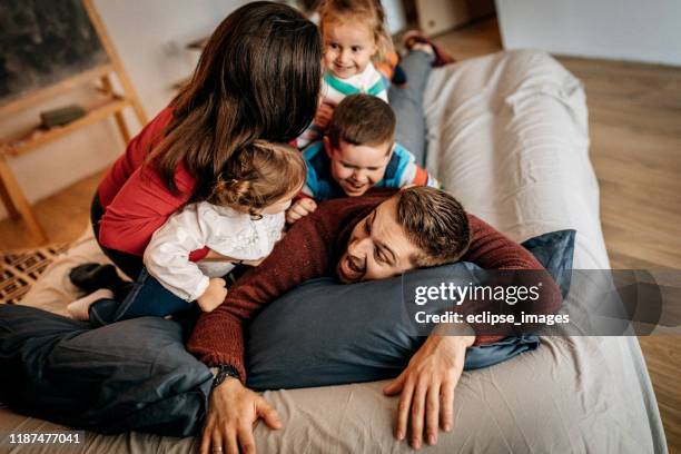 every day is funny day in our family - father and child and pillow fight stock pictures, royalty-free photos & images