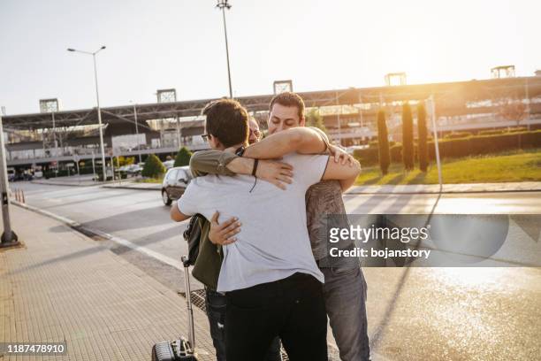 welcome hug - homecoming stock pictures, royalty-free photos & images