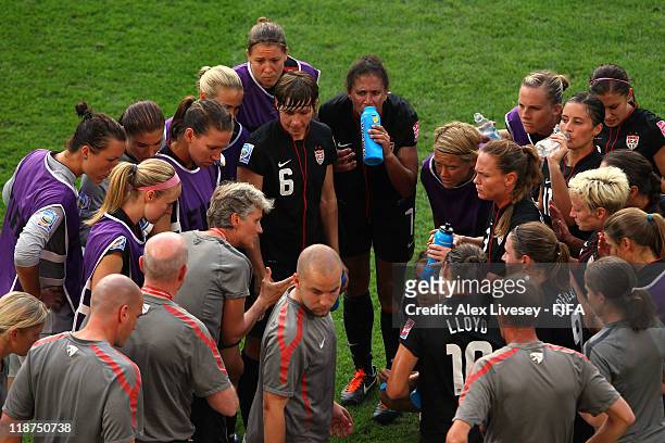 Pia Sundhage the coach of USA talks with her players as their match with Brazil goes in to extra time in the FIFA Women's World Cup Quarter Final...