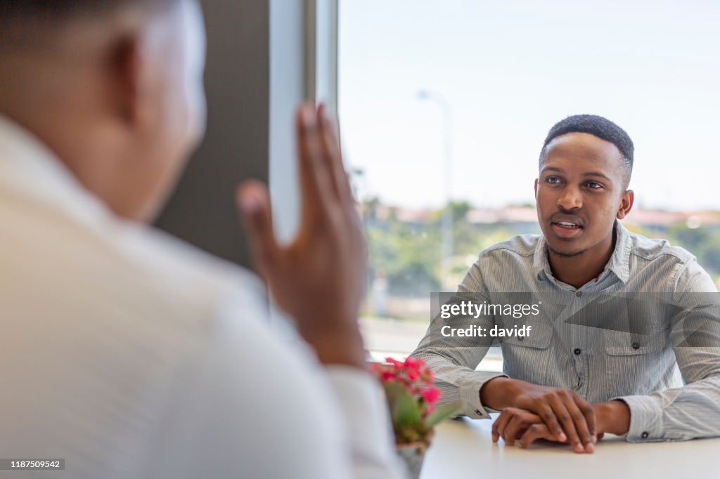 African Interview African Man Having A Job Interview High-Res Stock Photo - Getty Images