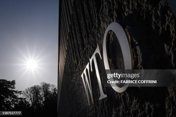 Sign of the World Trade Organization is seen at the trade intergovernmental organization headquarters in Geneva on December 10, 2019. - WTO announced...