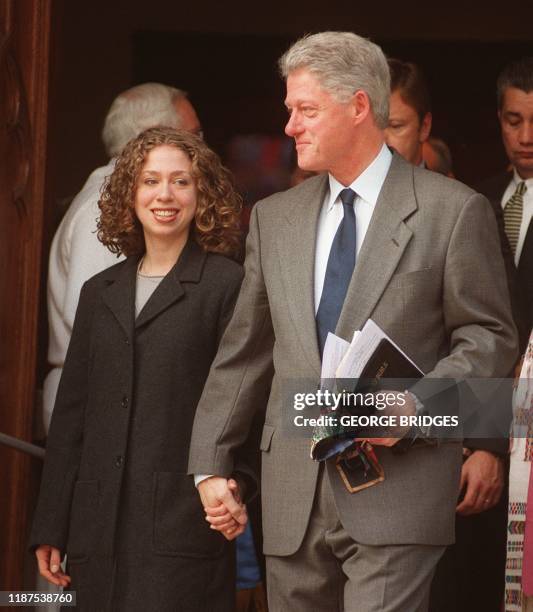 President Bill Clinton leaves Foundry Methodist church 20 December in Washington, DC, with his daughter Chelsea. Clinton has become the second...