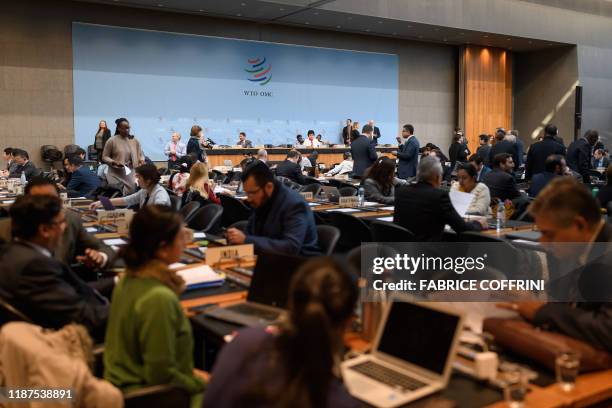 Delegates are seen prior to a general council meeting of the World Trade Organization on December 10, 2019 at the trade intergovernmental...