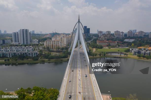 aerial scene, drone view of putrajaya bridge in kuala lumpur, malaysia - プトラジャヤ ストックフォトと画像