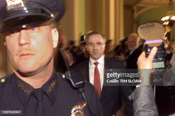 Senator Steve Buyer walks in the halls of the US Senate as Capitol Hill police hold back the media in the halls of the US Senate shortly before the...
