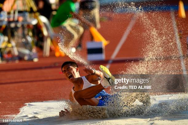 Ronne Malipay from the Philippines competes in the men's triple jump athletics event at the SEA Games in Clark, Capas, Tarlac province, north of...