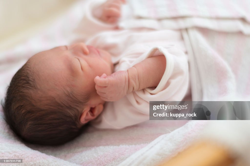 Baby sleeping in newborn room