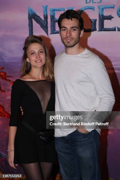 Alexis Loizon and a guest attend the "Frozen 2 - La Reine Des Neiges 2" Paris Gala Screening at Cinema Le Grand Rex on November 13, 2019 in Paris,...