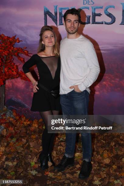 Alexis Loizon and a guest attend the "Frozen 2 - La Reine Des Neiges 2" Paris Gala Screening at Cinema Le Grand Rex on November 13, 2019 in Paris,...