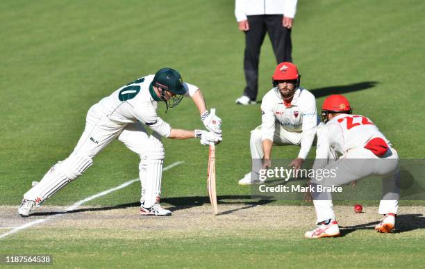 George Bailey of Tasmania blocks out the last over during day four of the Sheffield Shield match between South Australia and Tasmania at Adelaide...