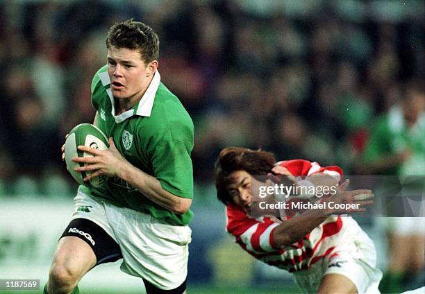 Brian O''Driscoll of Ireland goes over for a try past Daisuke Ohata of Japan during the International Friendly match between Ireland and Japan at...