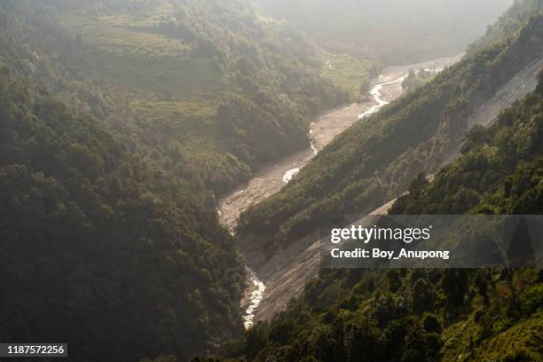 modi khola river view from chhomrong village in annapurna sanctuary, nepal. - river bottom park stock pictures, royalty-free photos & images