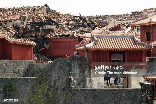 In this aerial image, fire fighters investigate the cause of Shuri Castle fire on November 1, 2019 in Naha, Okinawa, Indonesia.