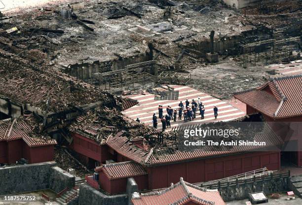 In this aerial image, fire fighters investigate the cause of Shuri Castle fire on November 1, 2019 in Naha, Okinawa, Indonesia.