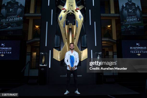 Driver Jean-Eric Vergne of France poses with the ABB FIA Formula E Championship trophy as he launches tickets for the 2020 Paris E-Prix on November...