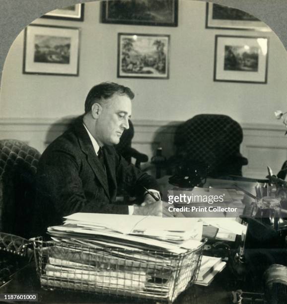 Franklin Delano Roosevelt, President of the United States at His Desk in the Executive Offices, Washington D.C', circa 1930s. President Roosevelt,...