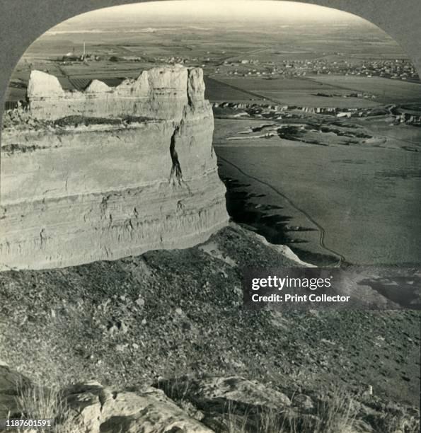 Looking Across Sugar Beet Fields and Sugar Plant, Platte River Valley, Scotts Bluff, Nebraska', circa 1930s. Scotts Bluff National Monument, named...