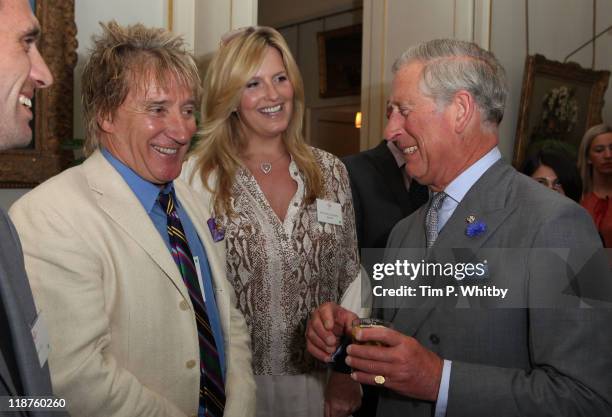 Rod Stewart and Penny Lancaster are greeted by Prince Charles, Prince of Wales at The Prince's Trust 35th Anniversary Reception at Clarence House on...