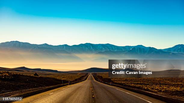 toiyabe mountains at sunrise on nevada loneliest road in america us-50 - nevada road stock pictures, royalty-free photos & images