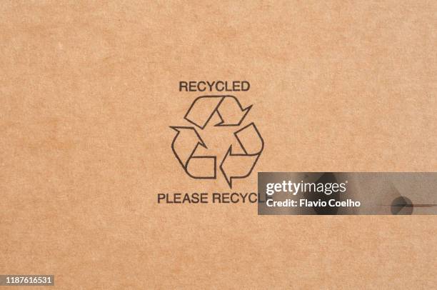 recycle symbol on the center of recycled paperboard - recycling center ストックフォトと画像