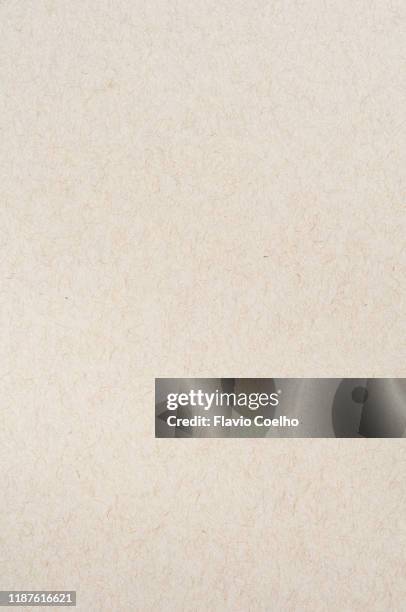 top view of gray toned recycled paper sheet - paper board stock-fotos und bilder