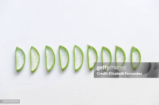 aloe vera slices on white background - aloe slices stock pictures, royalty-free photos & images