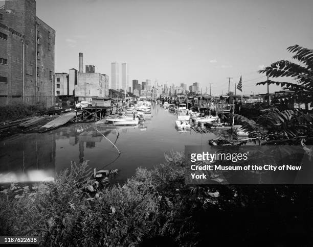View looking est from a marina toward the Lower Manhattan skyline, Jersey City, New Jersey, circa 1973 The Twin Towers of the World Trade Center are...