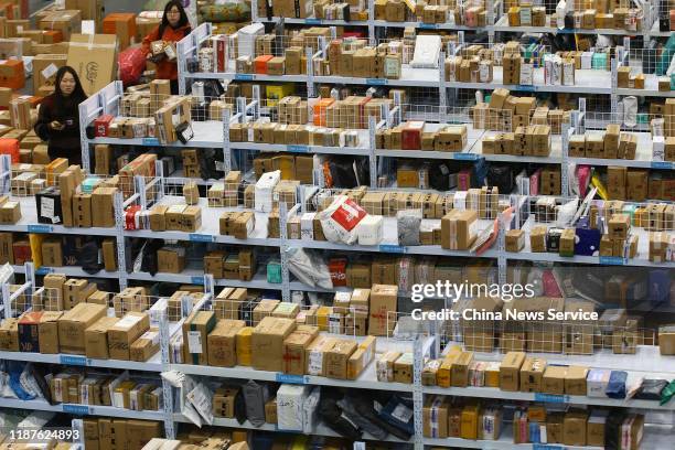 Students get their packages on shelves after Double 11 shopping festival at Nanjing University of Aeronautics and Astronautics on November 14, 2019...